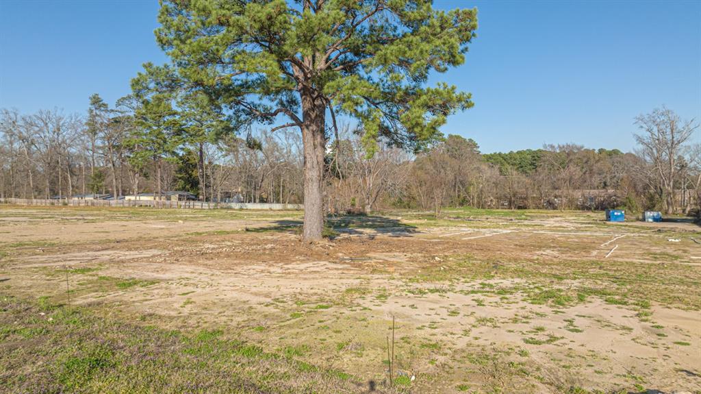 2100 Judson Road Longview, TX 75605 - Photo 25 of 35 a view of a field with trees in the background