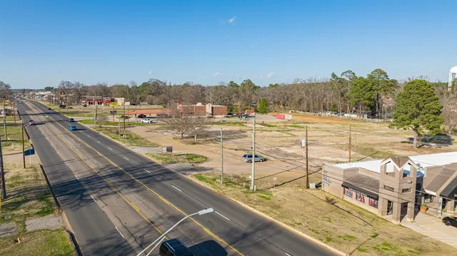 an aerial view of a houses with an outdoor space