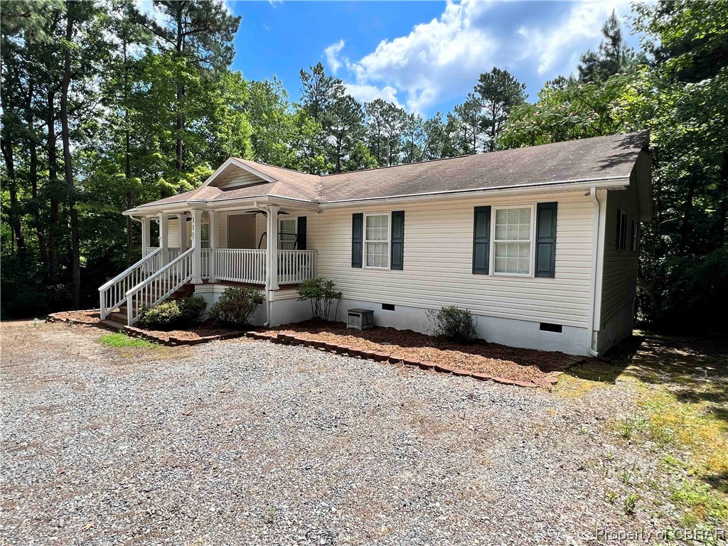 110 Sutherland Street Lancaster, VA 22503 - Photo 2 of 19 a front view of a house with a yard