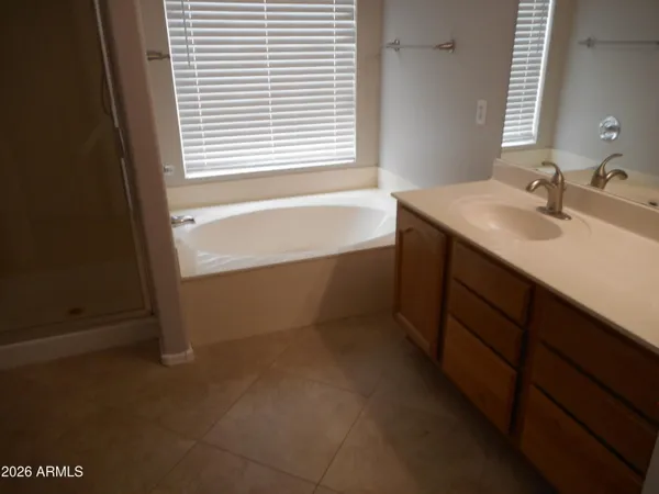 a bathroom with a bathtub and a sink