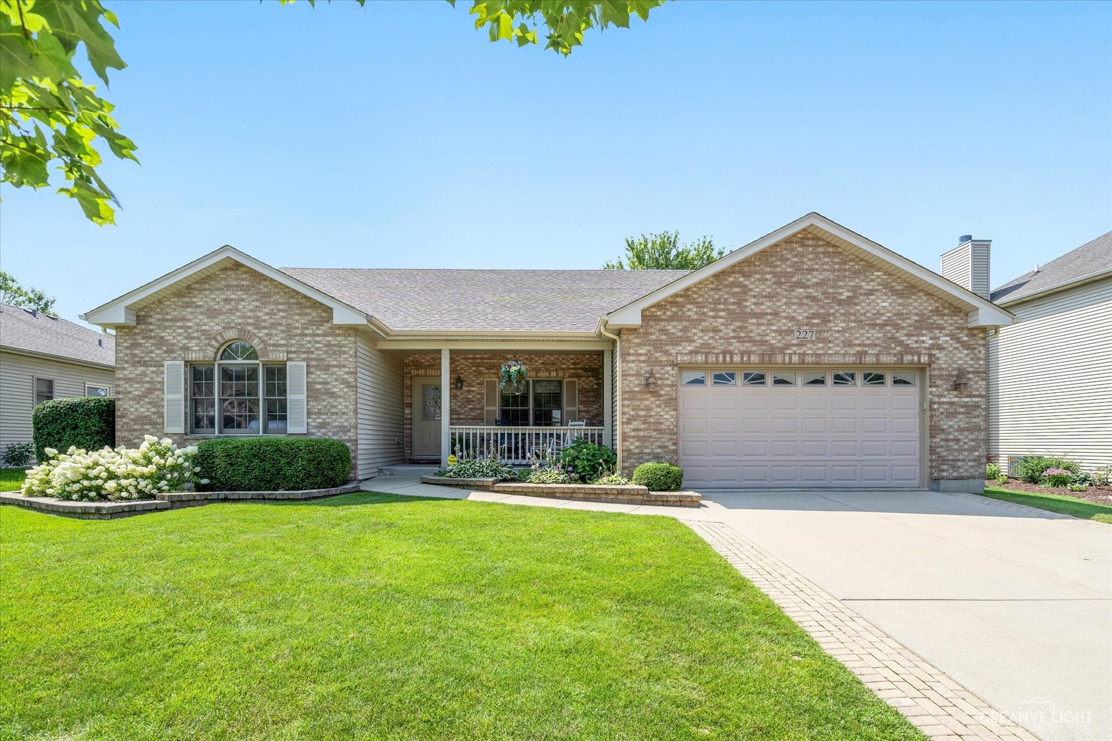 227 Red Hawk Drive Hampshire, IL 60140 - Photo 1 of 37 a front view of a house with a yard and garage