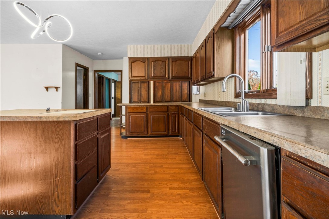 3290 State Rte 534 Geneva, OH 44041 - Photo 5 of 43 Kitchen featuring hardwood / wood-style flooring, sink, and dishwasher