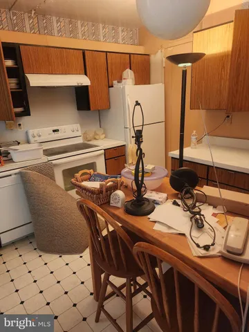 a kitchen with stainless steel appliances granite countertop a refrigerator sink and cabinets