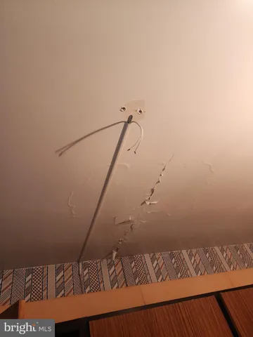 a kitchen with a white stove refrigerator and cabinets