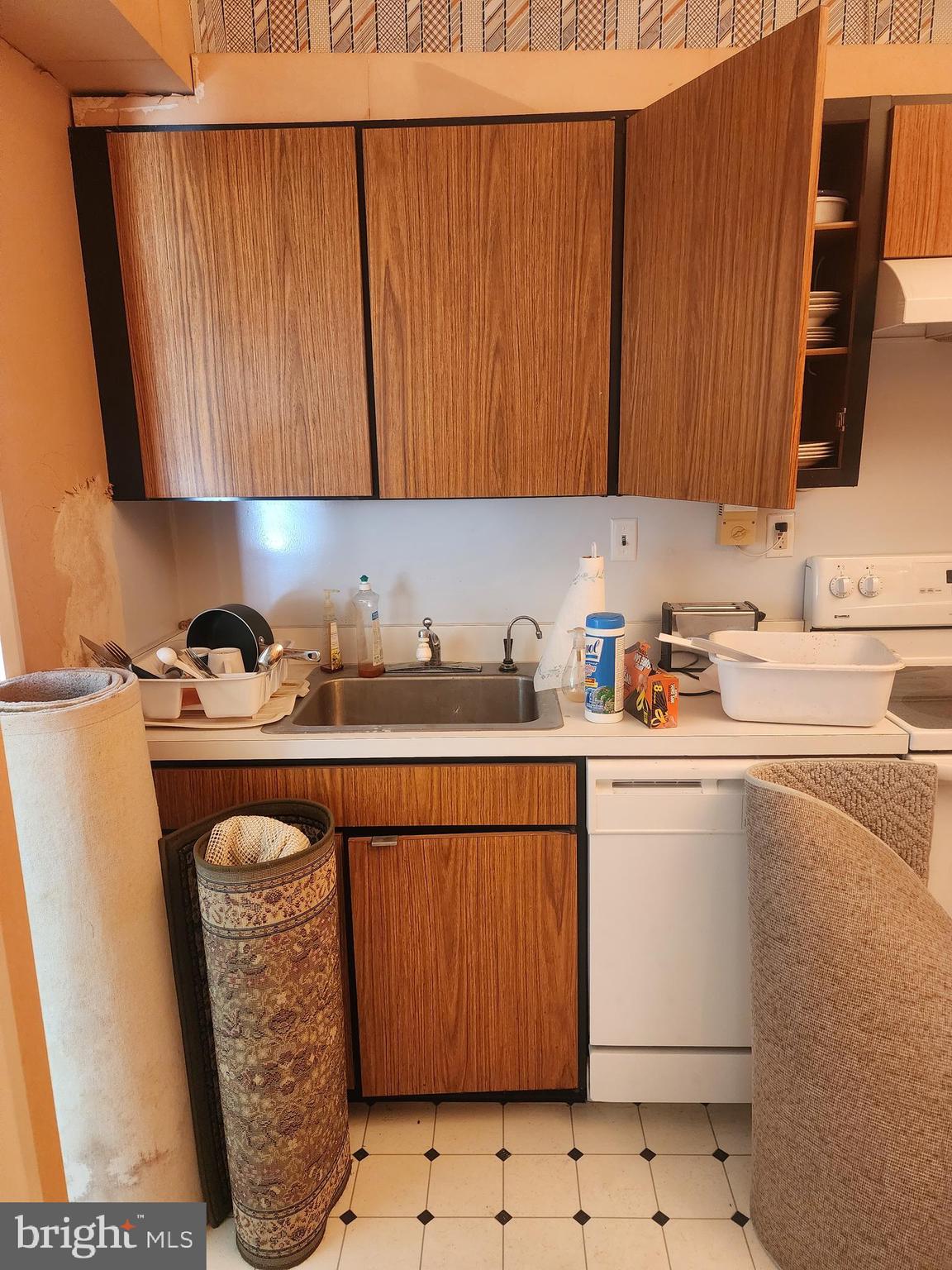3601 Clarks Lane, Unit 416 Baltimore, MD 21215 - Photo 13 of 68 a kitchen with stainless steel appliances granite countertop a refrigerator sink and cabinets