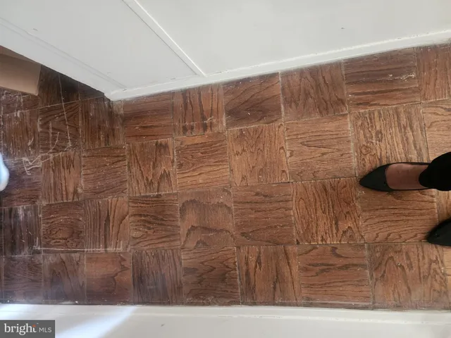 a view of a hallway with a living room