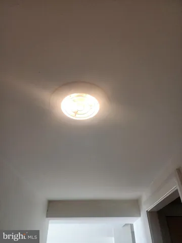 a bathroom with a granite countertop sink and mirror
