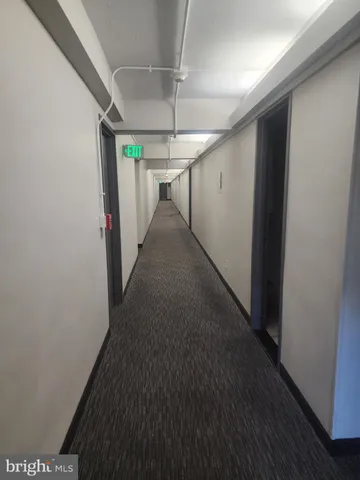 a view of a hallway with a white door