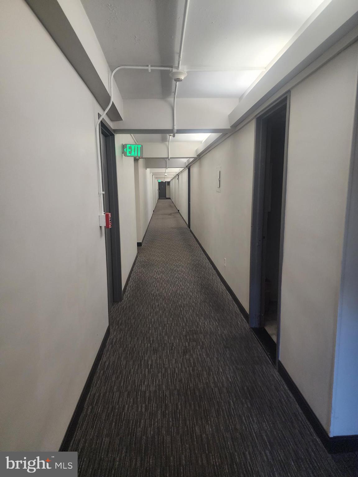 3601 Clarks Lane, Unit 416 Baltimore, MD 21215 - Photo 3 of 68 a view of a hallway with a white door