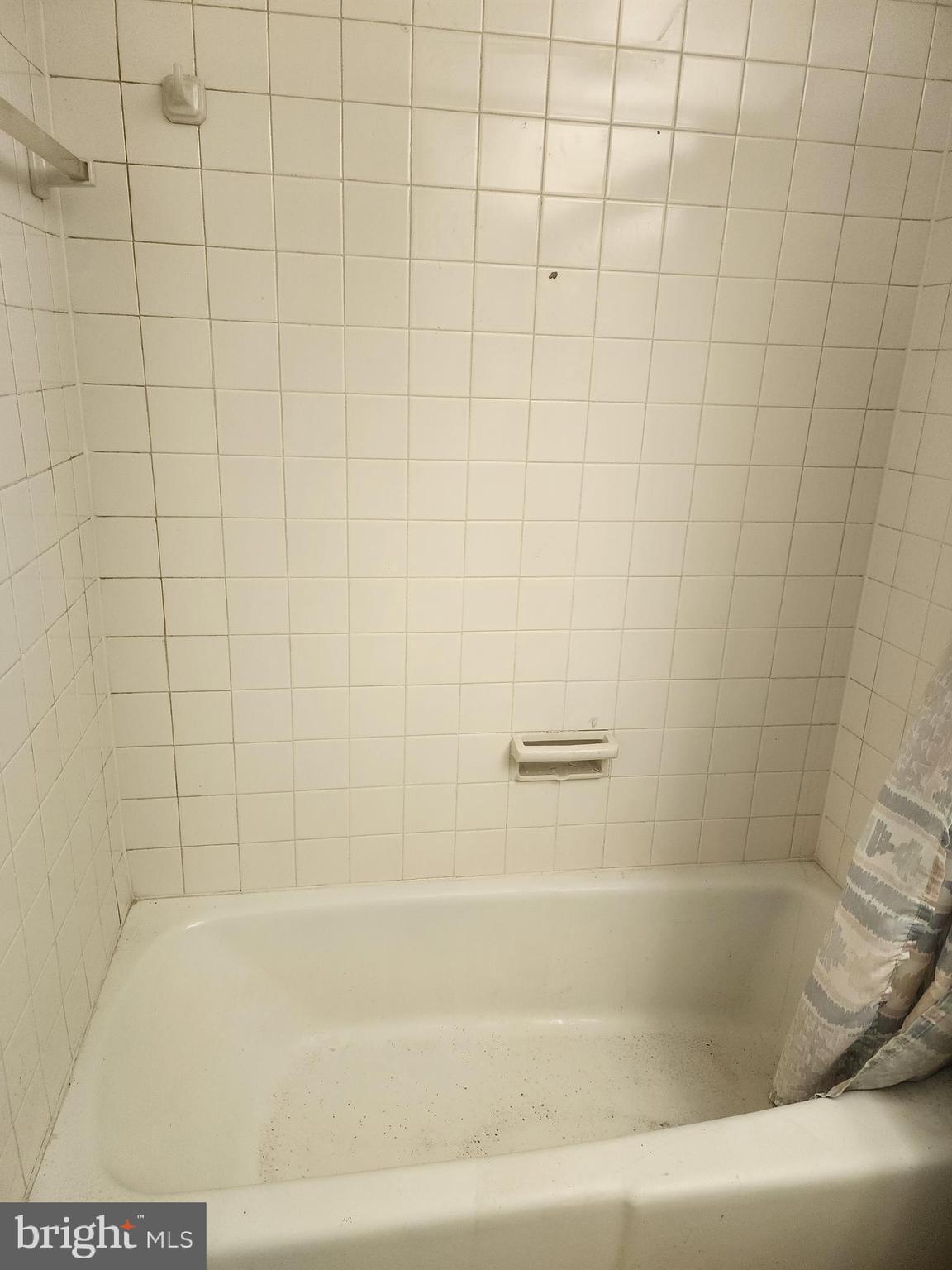 3601 Clarks Lane, Unit 416 Baltimore, MD 21215 - Photo 36 of 68 a close up of a bathtub in a bathroom