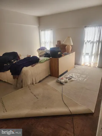 a bathroom with a shower toilet and sink