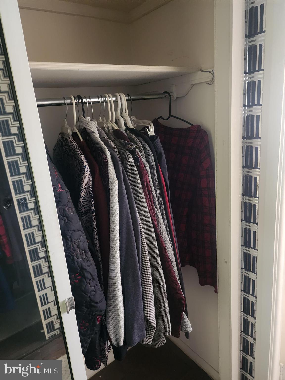 3601 Clarks Lane, Unit 416 Baltimore, MD 21215 - Photo 46 of 68 a view of walk in closet with clothes and shoes