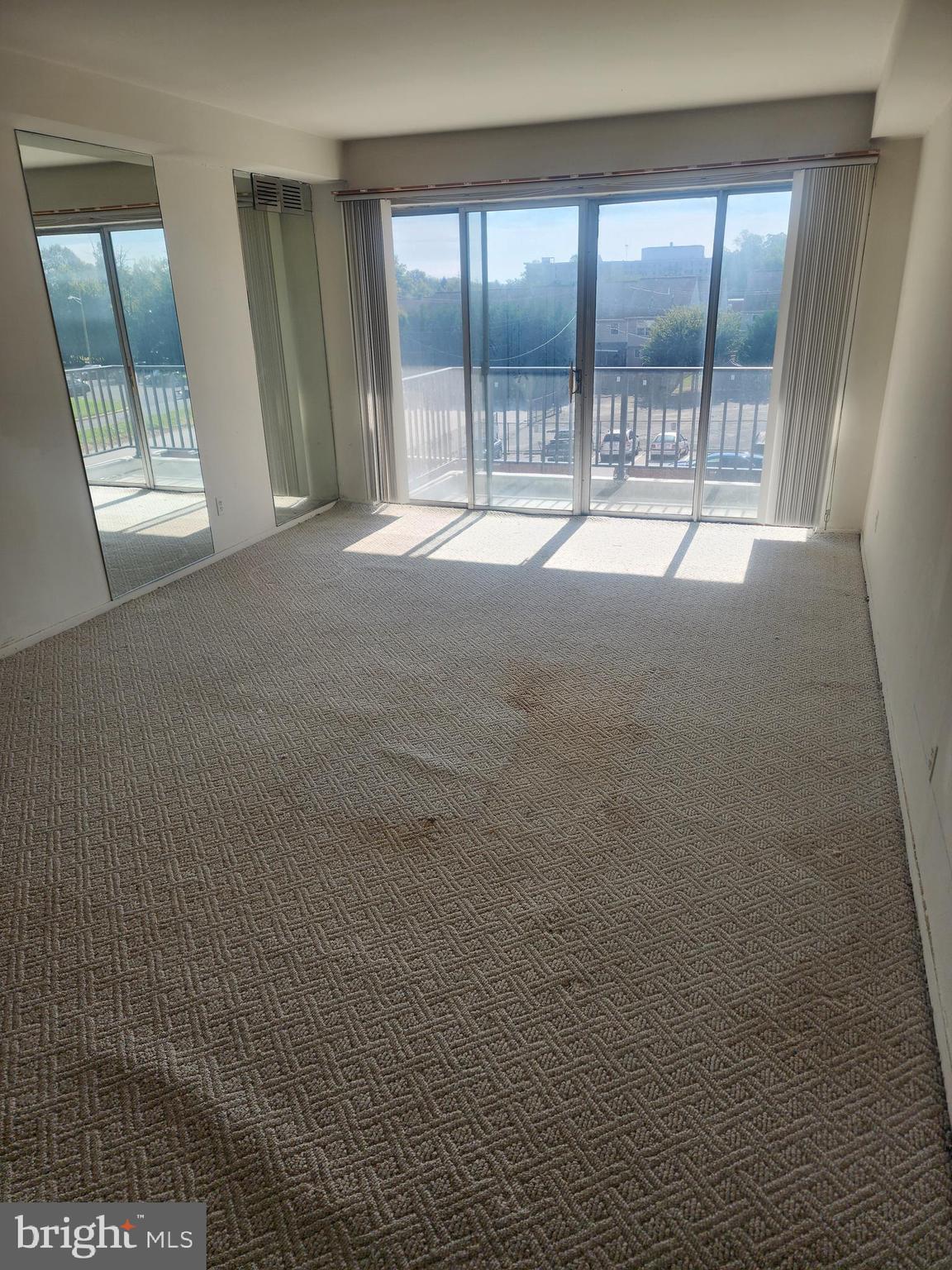 3601 Clarks Lane, Unit 416 Baltimore, MD 21215 - Photo 6 of 68 a view of an empty room with a window