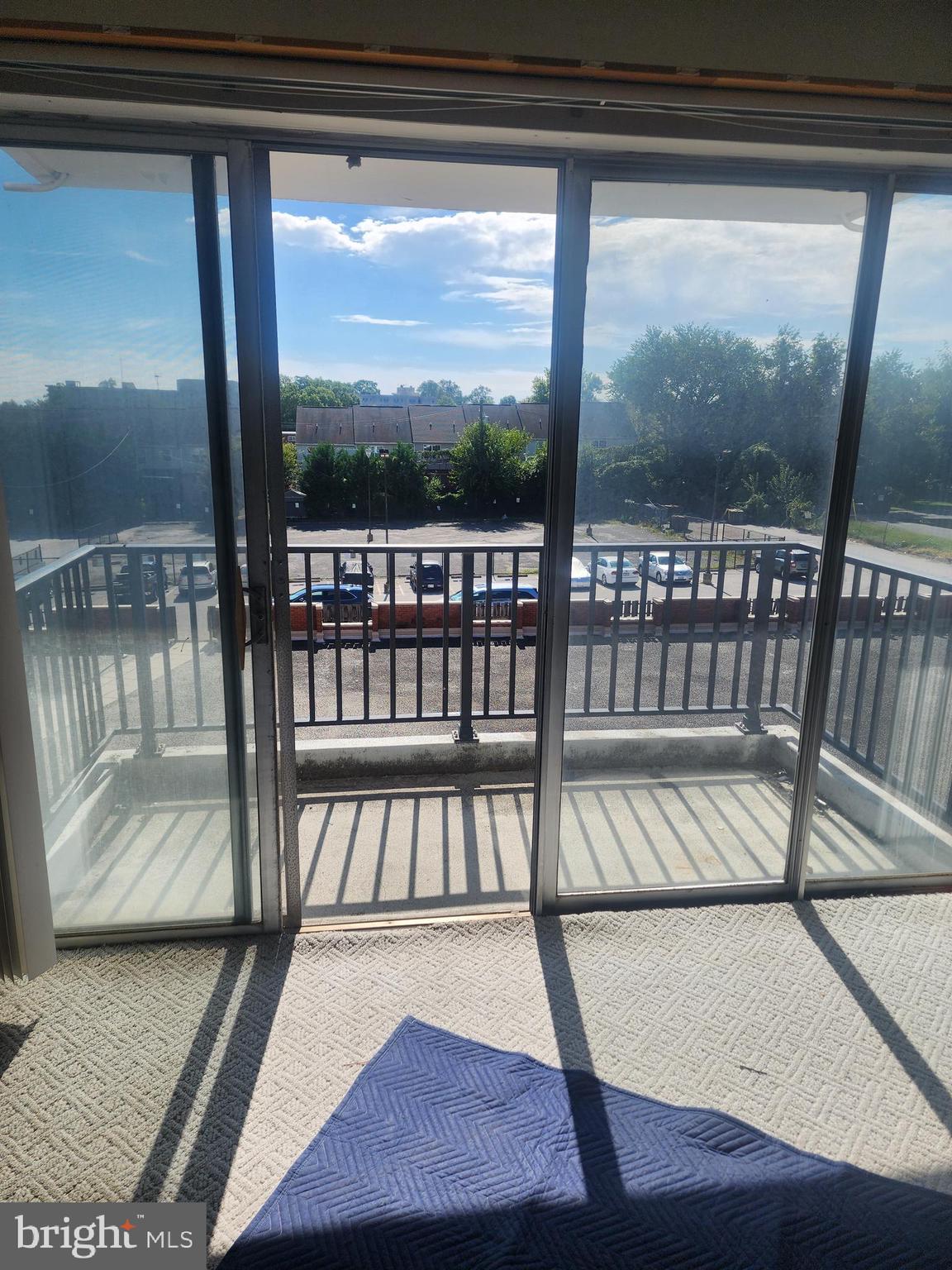 3601 Clarks Lane, Unit 416 Baltimore, MD 21215 - Photo 61 of 68 a view of a balcony with wooden floor