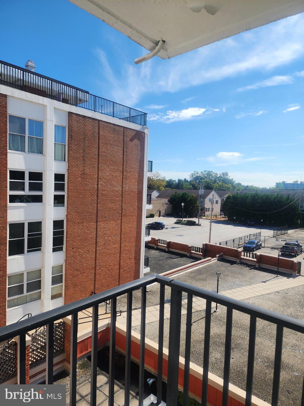3601 Clarks Lane, Unit 416 Baltimore, MD 21215 - Photo 64 of 68 a view of a balcony with furniture and a floor