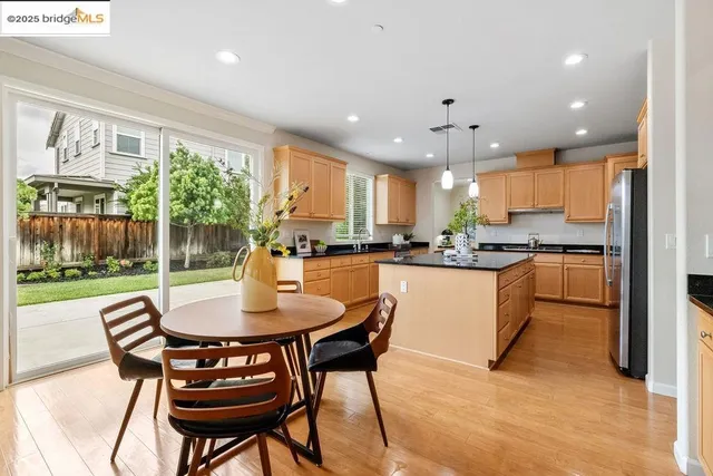 a kitchen with a table and chairs in it
