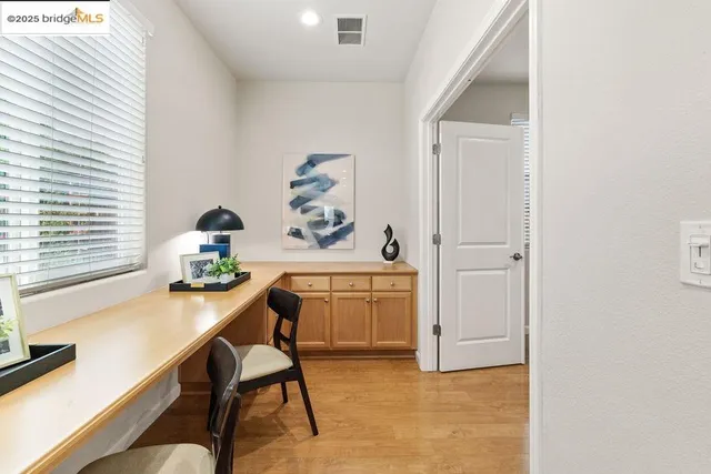 a workspace with furniture and window