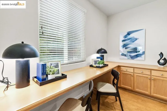 a workstation with a chair and a potted plant