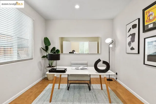 a living room with furniture a rug and a window