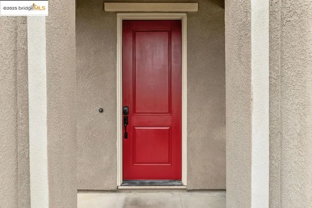 a view of a red door in the house