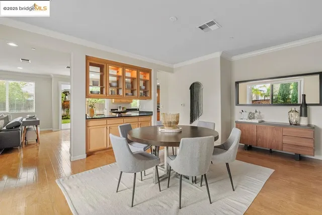 a view of a dining room with furniture window and wooden floor