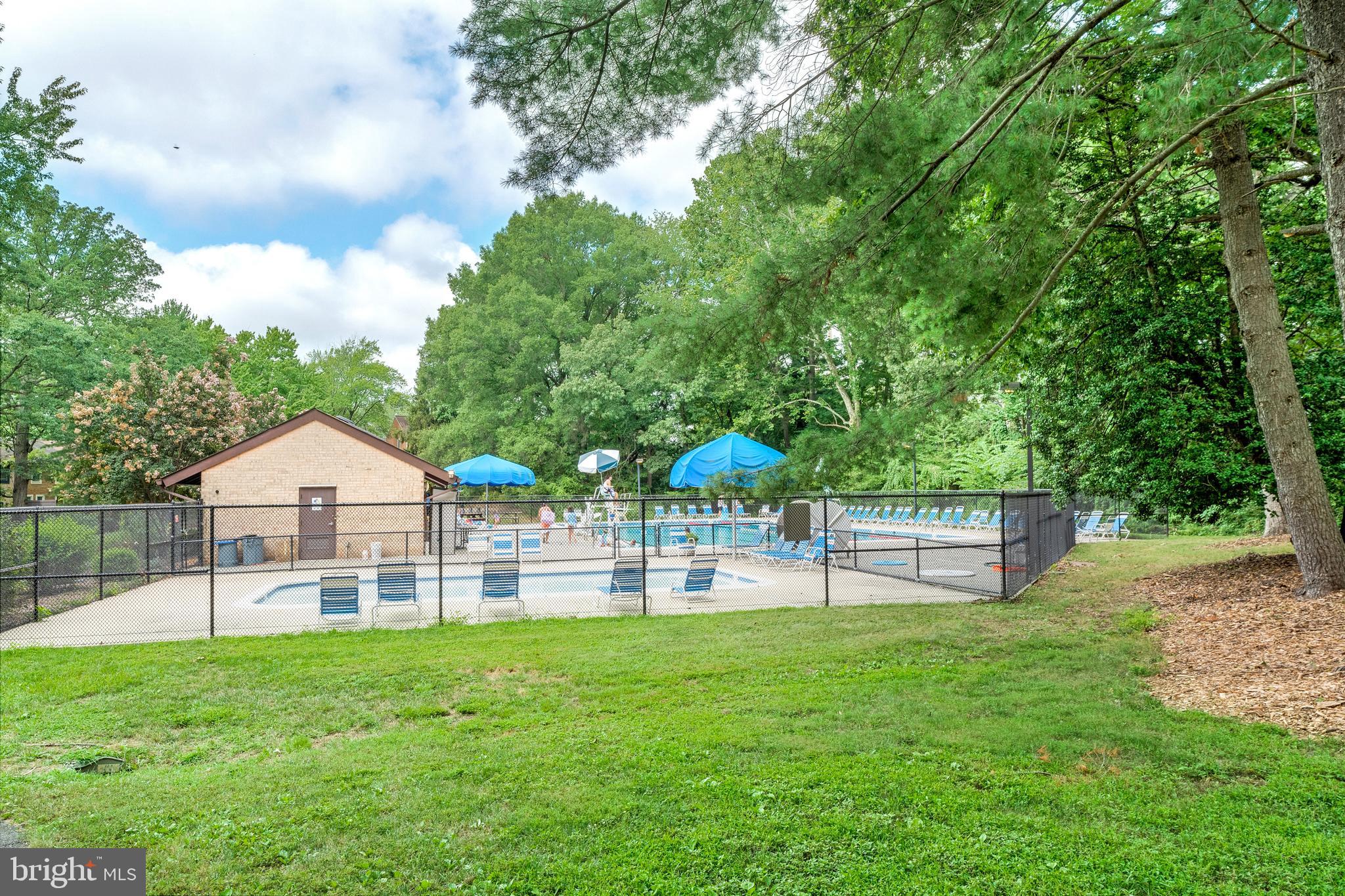 11637 Newbridge Court Reston, VA 20191 - Photo 47 of 63 a view of a house with a yard and sitting area
