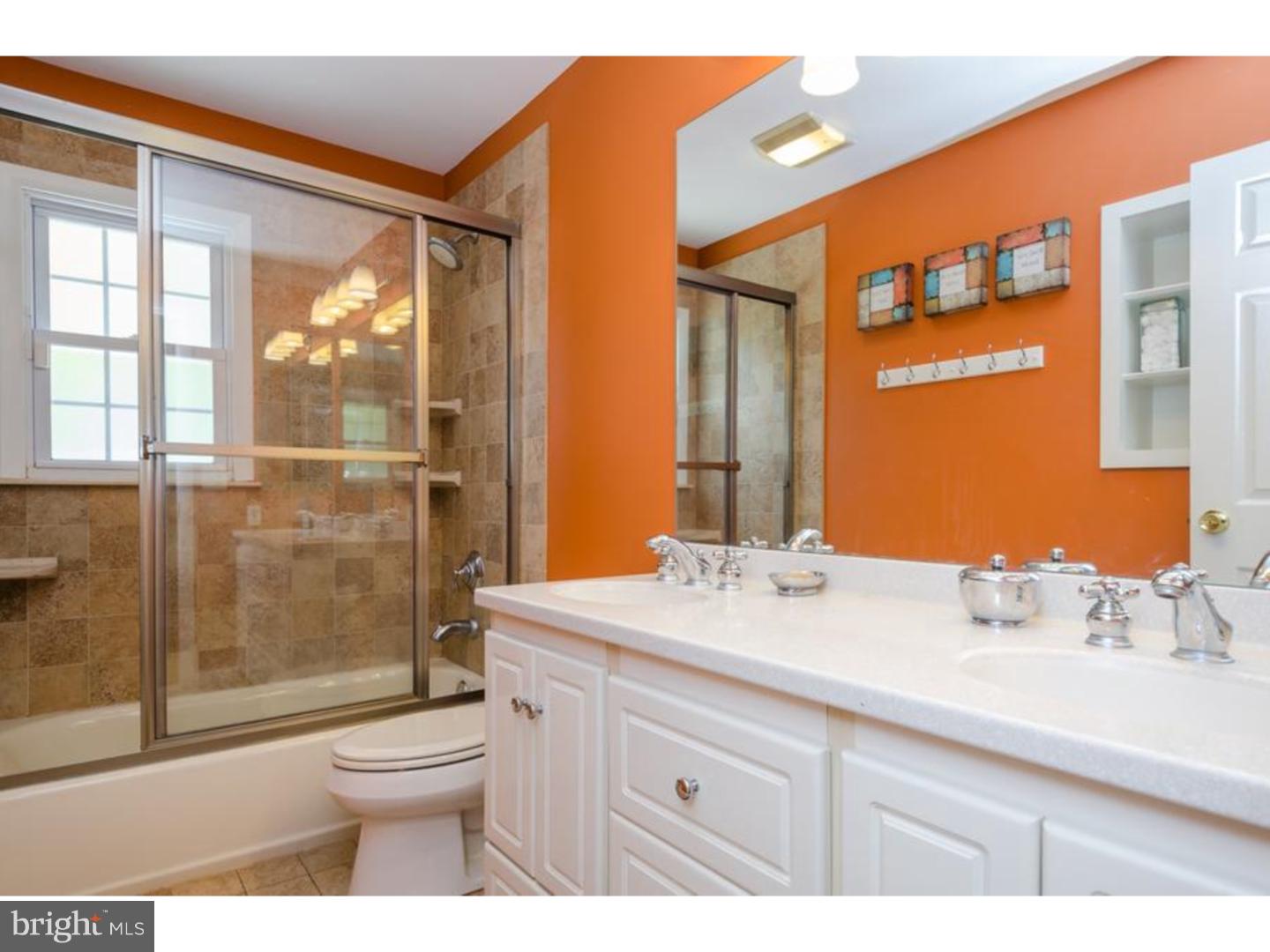 3 Griggs Road Cranbury, NJ 08512 - Photo 17 of 25 a bathroom with a sink a toilet a glass door shower and a mirror