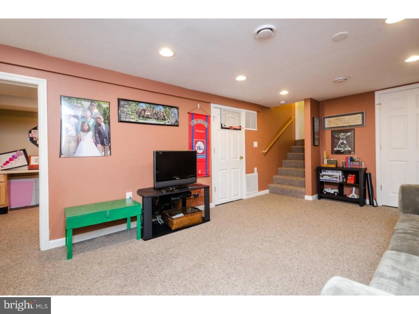 3 Griggs Road Cranbury, NJ 08512 - Photo 18 of 25 a living room with furniture and a flat screen tv