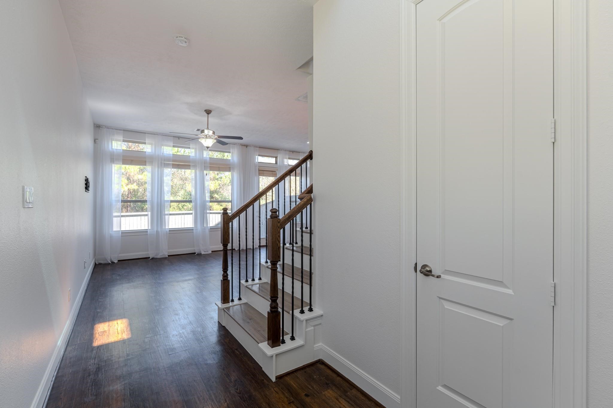 58 Aventura Place Spring, TX 77389 - Photo 7 of 23 a view of entryway and hall with wooden floor