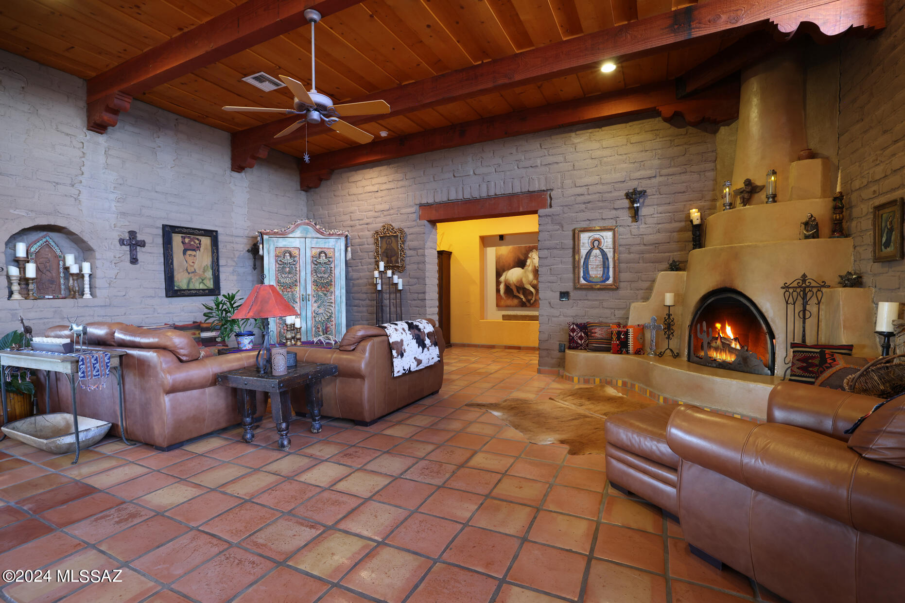 11725 East Spanish Ridge Place Tucson, AZ 85730 - Photo 14 of 51 a living room with furniture and a fireplace