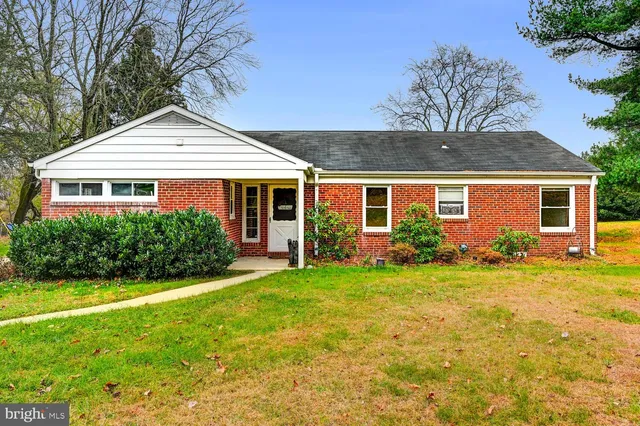 a front view of a house with a yard and porch