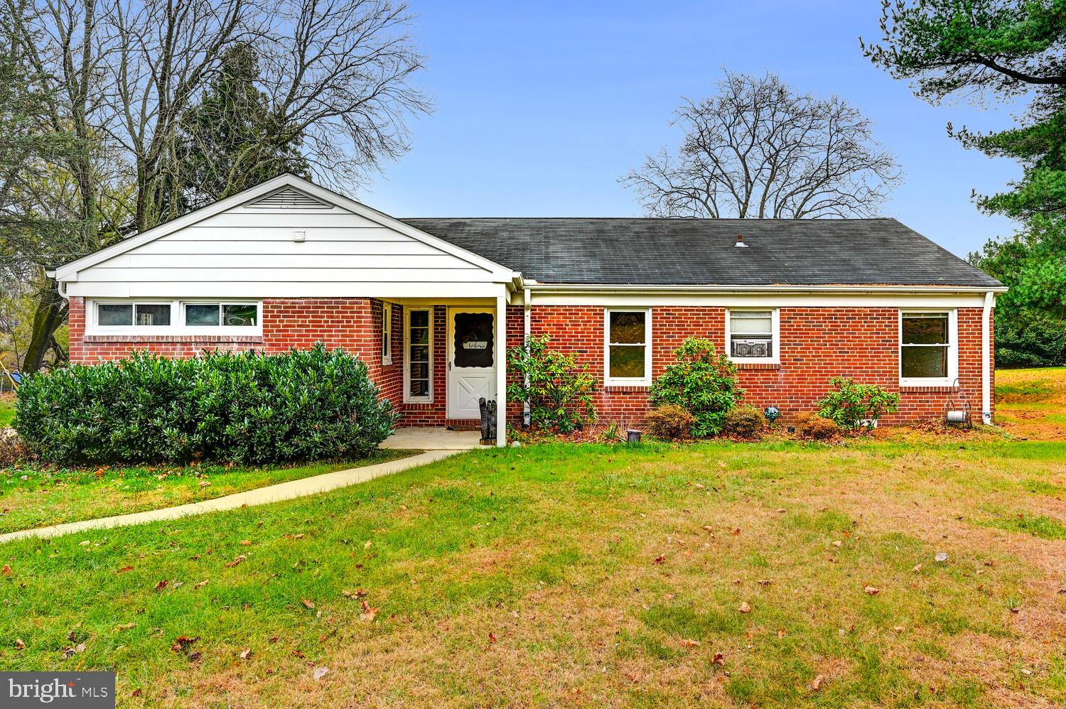 3925 Dance Mill Road Phoenix, MD 21131 - Photo 2 of 26 a front view of a house with a yard and porch