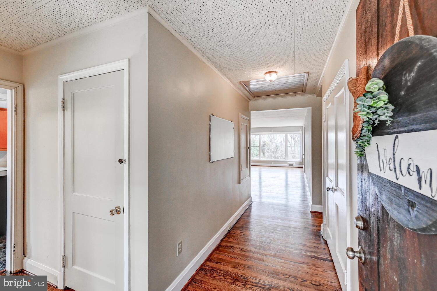 3925 Dance Mill Road Phoenix, MD 21131 - Photo 3 of 26 a view of a hallway with wooden floor and staircase