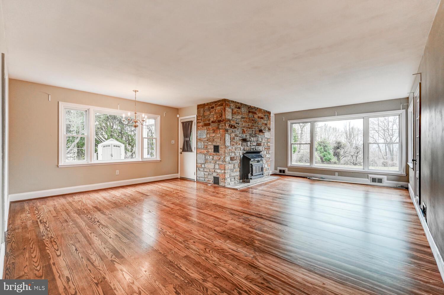 3925 Dance Mill Road Phoenix, MD 21131 - Photo 4 of 26 an empty room with wooden floor and windows