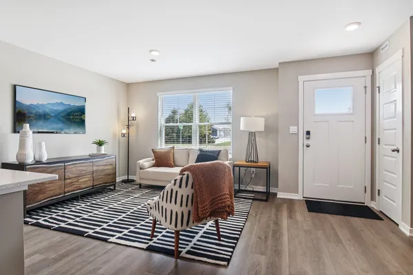 a living room with furniture and a window