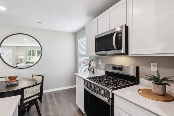 a kitchen with a stove and a microwave