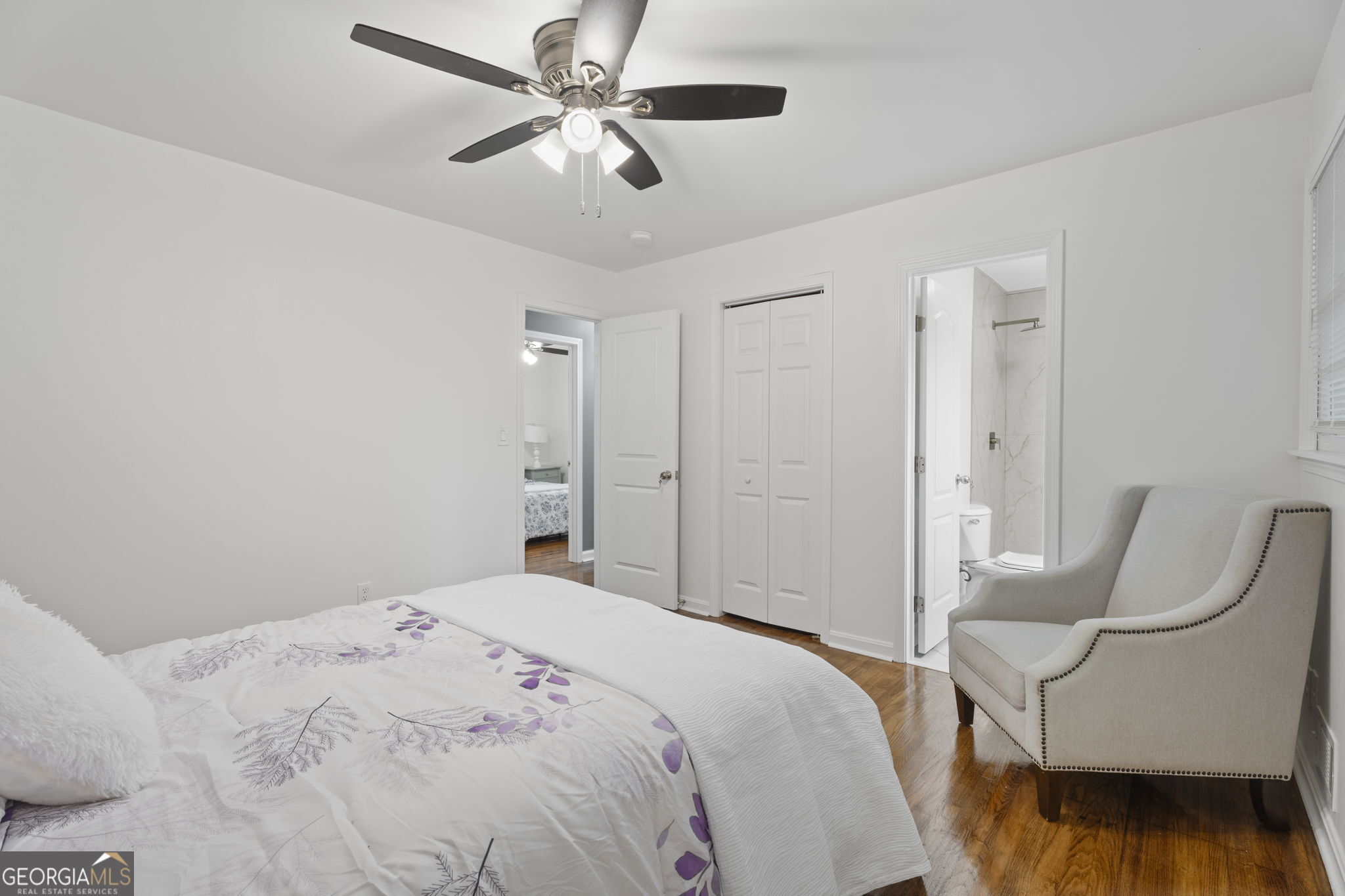 3567 Forrest Park Road Southeast Atlanta, GA 30354 - Photo 20 of 29 a bedroom with a bed and chair