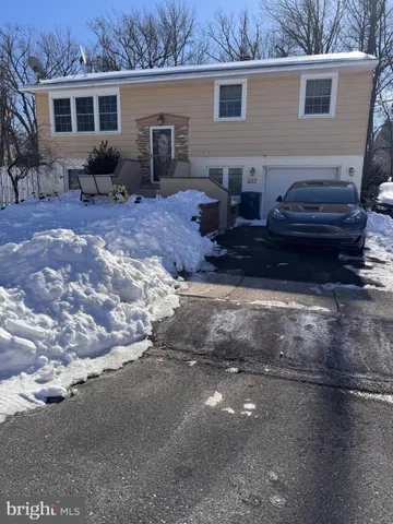 a view of a backyard with table and chairs
