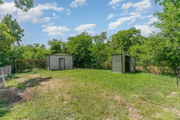 a backyard of a house with lots of green space