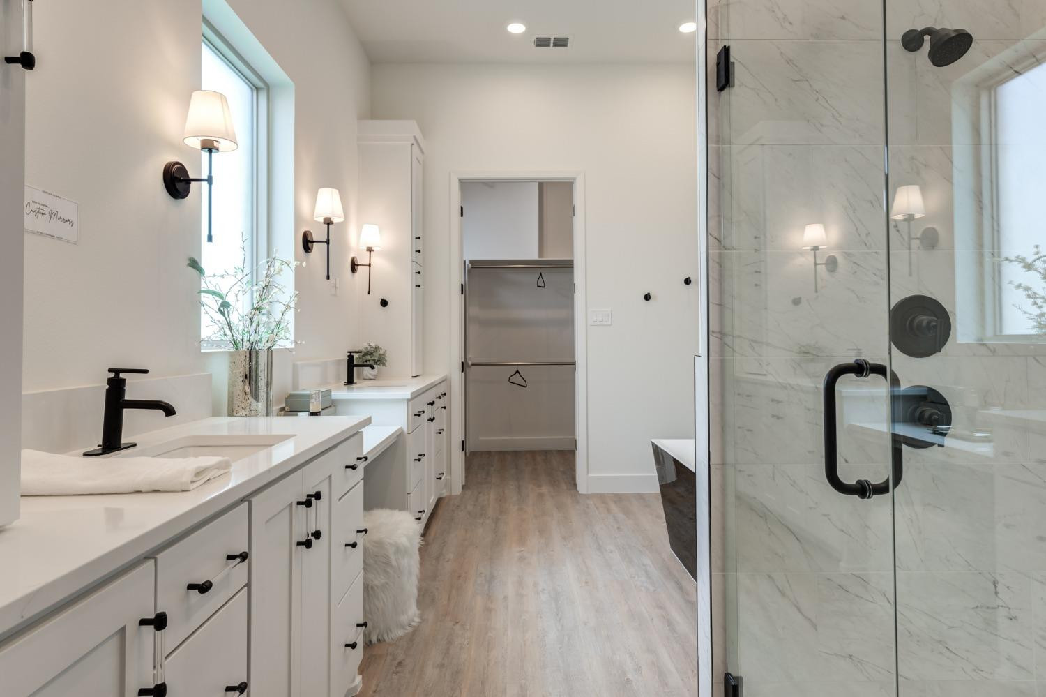3803 127th Street Lubbock, TX 79423 - Photo 23 of 44 a bathroom with a granite countertop sink a toilet a glass door shower and a mirror