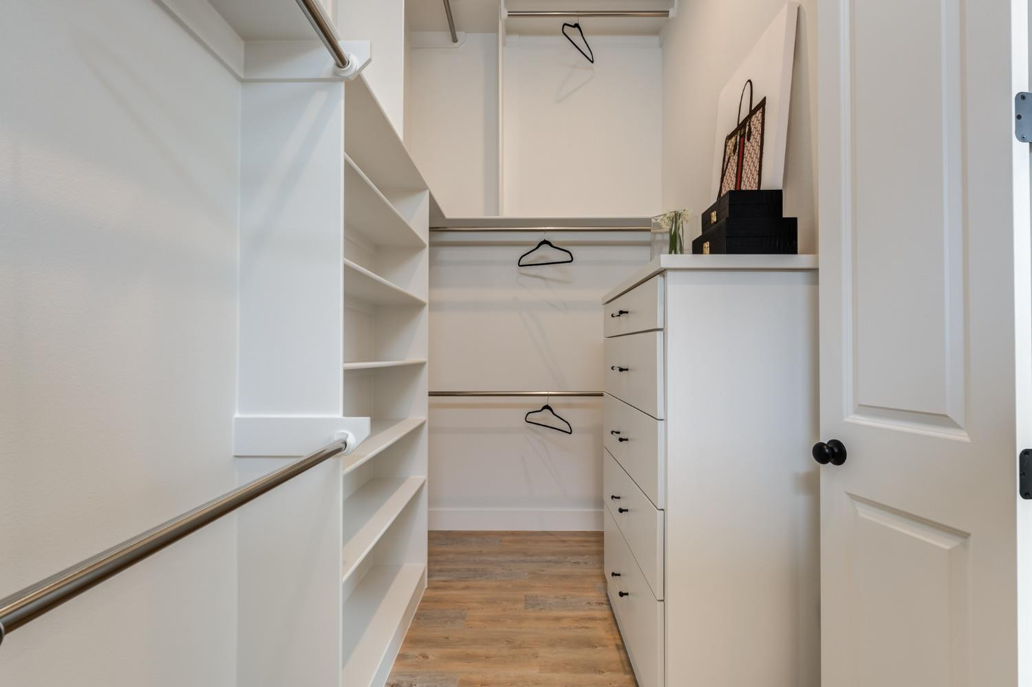 3803 127th Street Lubbock, TX 79423 - Photo 27 of 44 a view of walk in closet with clothes