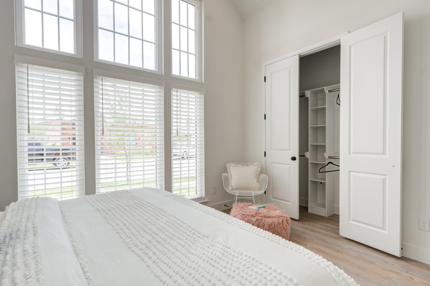 3803 127th Street Lubbock, TX 79423 - Photo 33 of 44 a bedroom with a bed and a large window