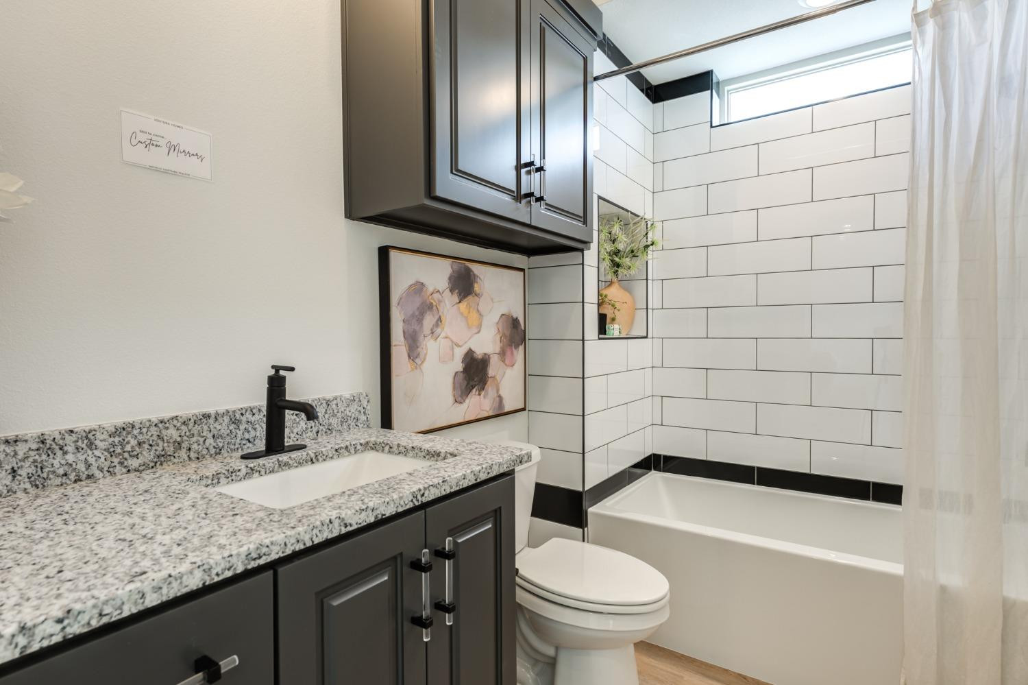 3803 127th Street Lubbock, TX 79423 - Photo 34 of 44 a bathroom with a granite countertop sink a toilet and mirror