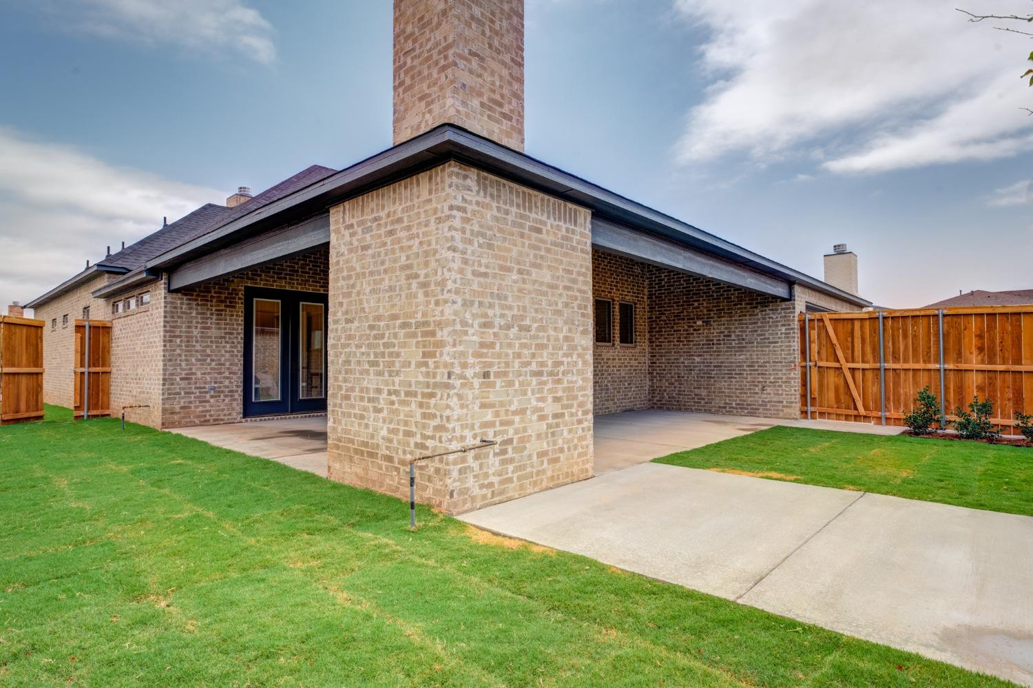 3803 127th Street Lubbock, TX 79423 - Photo 43 of 44 a front view of a house with garden