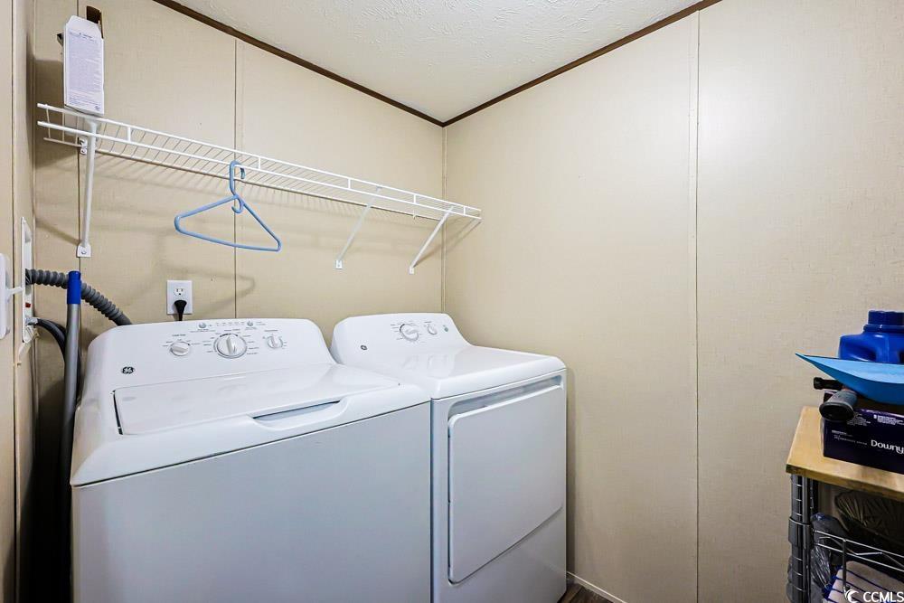 255 Quail Run Road Loris, SC 29569 - Photo 20 of 29 Laundry area with crown molding, independent washer and dryer, and a textured ceiling