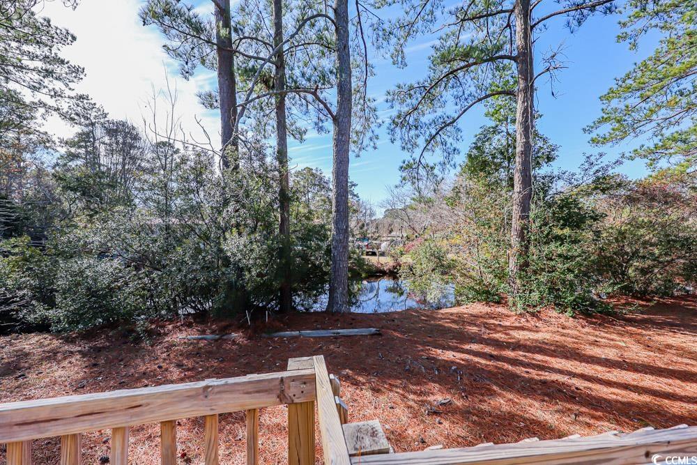 255 Quail Run Road Loris, SC 29569 - Photo 22 of 29 View of yard with a deck with water view