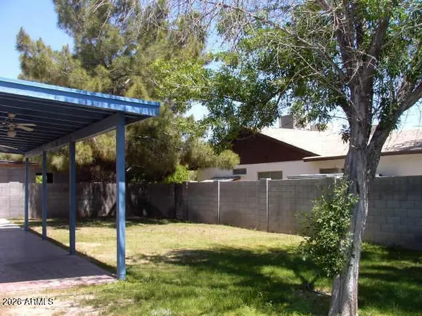a view of a backyard of the house