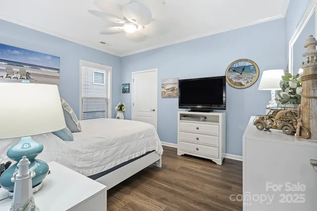 a bedroom with a bed and flat screen tv