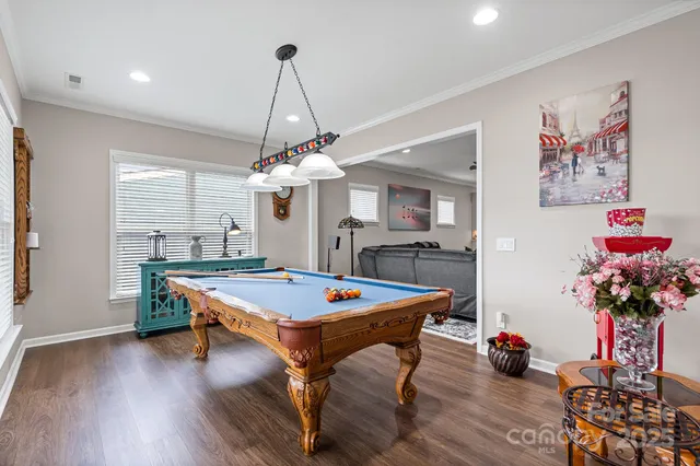 a room with furniture and wooden floor