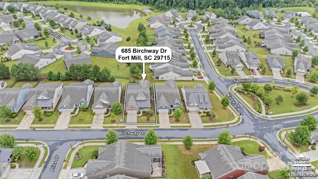 an aerial view of residential house with outdoor space and parking